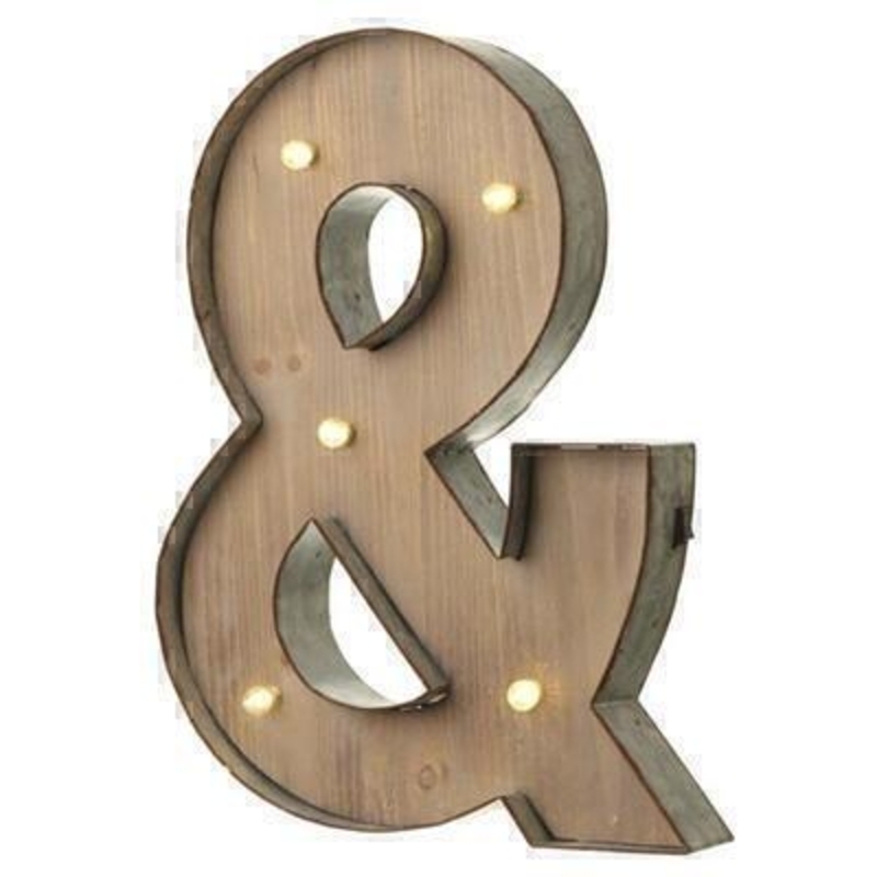 This & Sign With LED Lights by Heaven Sends could be paired with other letters to create a bespoke initial sign for a couple and or to be displayed on its own. Large in size this & sign has got LED lights and a switch on the side to turn it on. Made from wood and metal. Size: 32x5x41cm